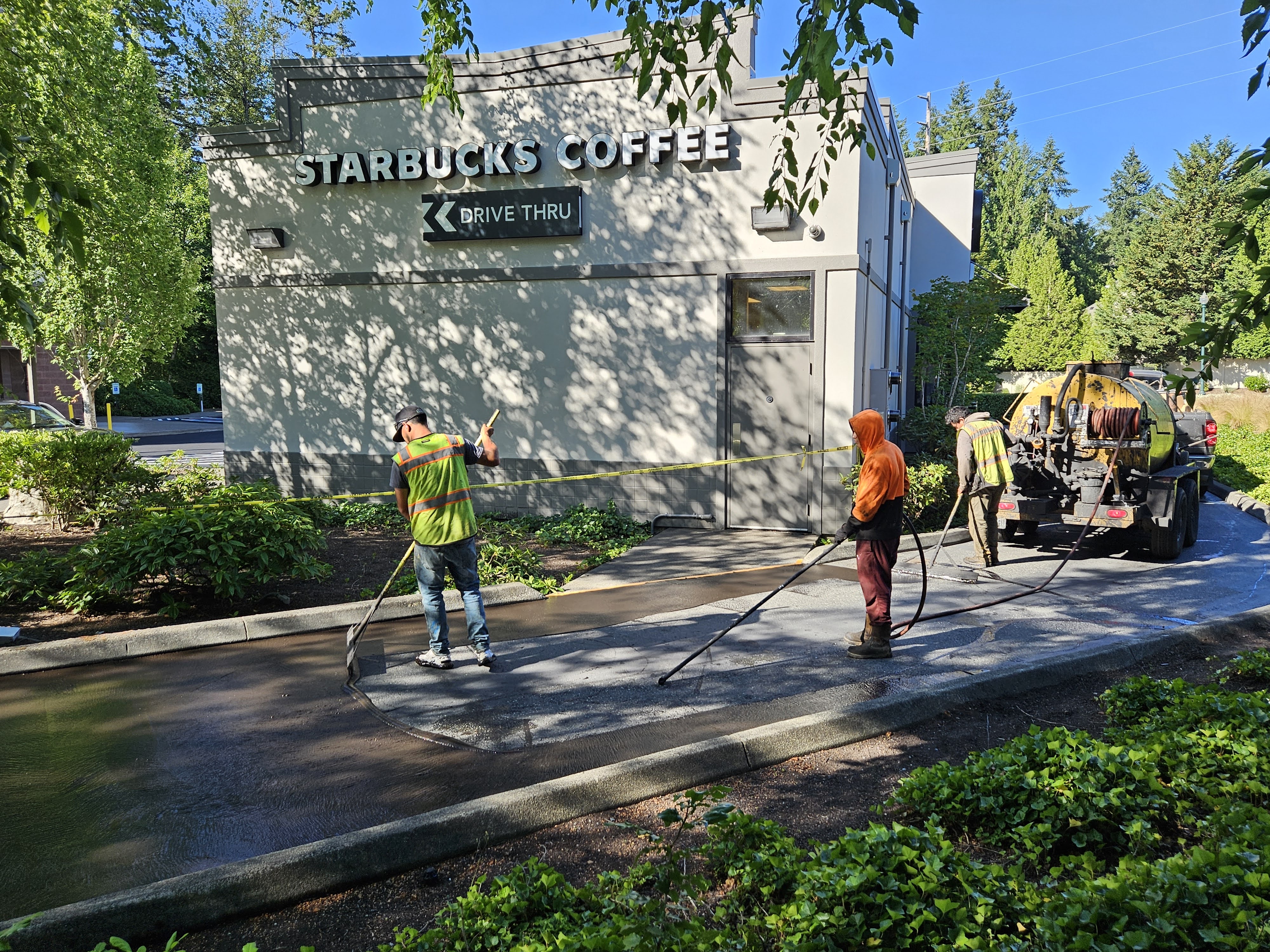 Asphalt sealcoating application on parking lot in Redmond, WA
